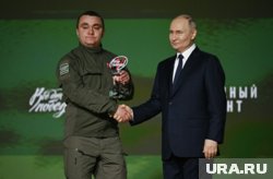 Солдатов получил награду из рук Путина