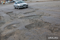 Состояние дорог города Кургана, разбитая дорога, ямы в асфальте