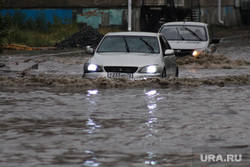 Flooded Kirov street.  Mound, flooded street, downpour, flood, rain, downpour aftermath