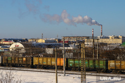 Виды города. Курган, тэц, железнодорожные пути, завод, поезд ржд, экология