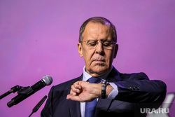 International Forum of Volunteers in Moscow at VDNKh.  Moscow, Sergey Lavrov, portrait, looking at his watch