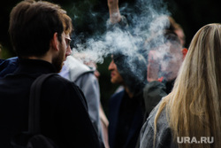 Solemn line of students of KSU in the Central Park of Culture and Culture.  Kurgan, smoking, students, vape, electronic cigarette, IQOS