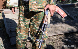The village of Karmir Shuka after shelling by the Azerbaijani Armed Forces.  Nagorno-Karabakh, Kalashnikov assault rifle, volunteer, Nagorno-Karabakh militia, RNK militia, Republic of Nagorno-Karabakh